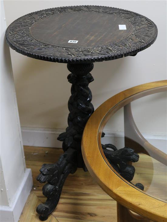 A carved tripod table W.55cm